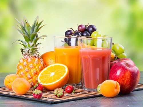 Assortment of fresh fruits, vegetables and juices