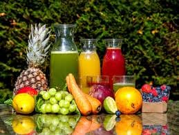 Fresh fruits and juices on bamboo mat